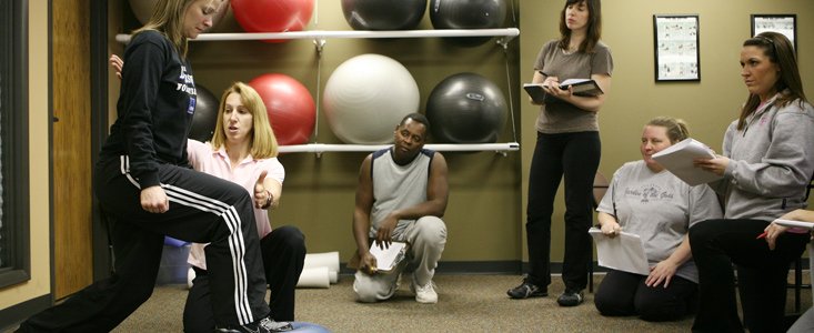 Fitness Training Students learning proper movement techniques at WellSpring