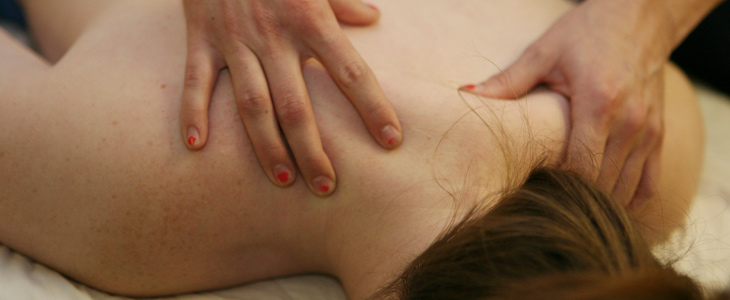Close up of a client receiving relaxing shoulder massage.